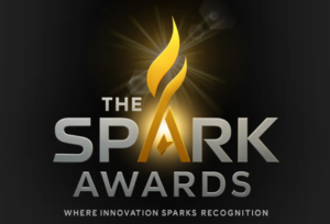 Realist Lab's Spark Awards logo on a black background